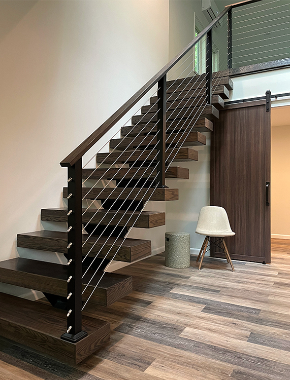 Floating wood stairs to the loft.